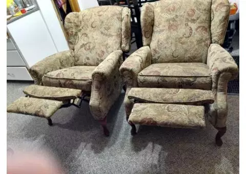 Two wingback recliner chairs